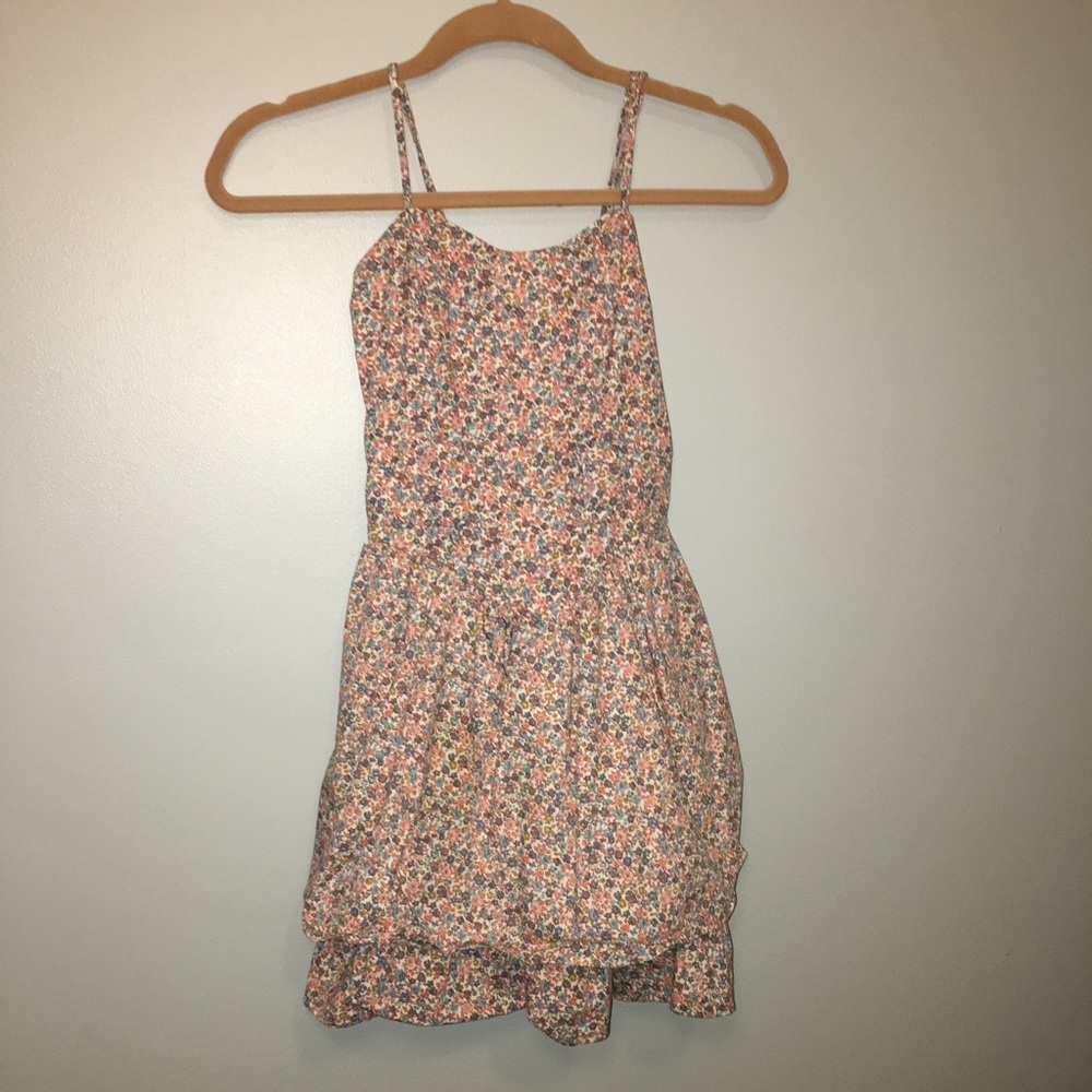 cream colored dress with blue and red flowers